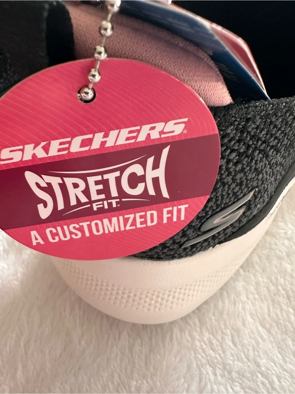 Skechers Women’s Black Glimmer Slip-On Sneakers with Pink Lining